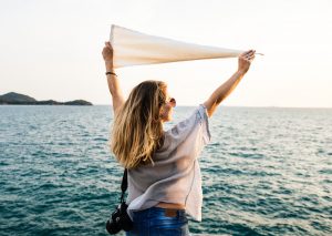 Woman standing on the edge if water