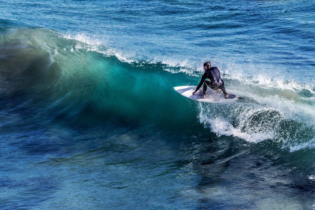 A man surfing.
