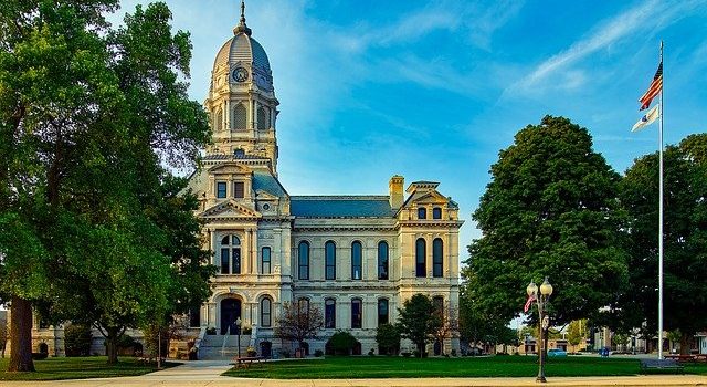 Courthouse, garden and trees. 