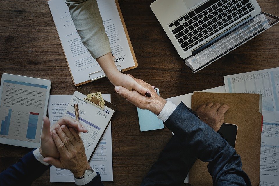 Two people shaking hands.