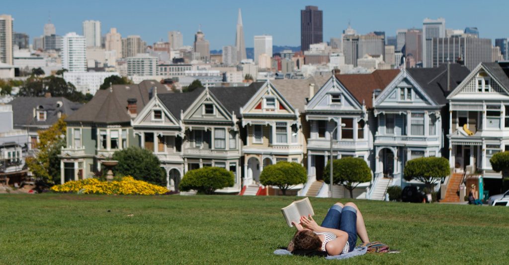 woman on the grass reading