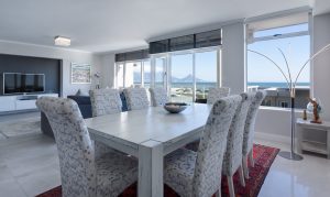 white chairs and a white dining ready for packing and moving a dining room