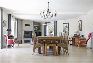 a dining room table with a set of chairs around it