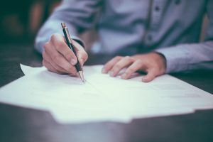 a man signing moving insurance