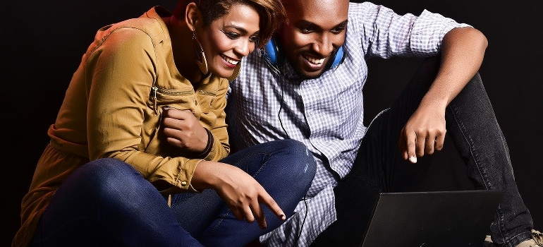 A couple looking at a computer