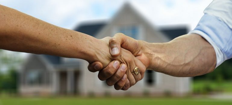 A handshake after hiring the best cross country movers West Virginia