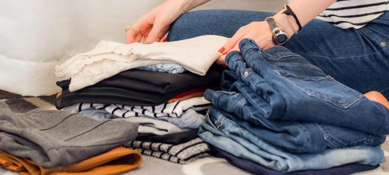 a girl folding colthes