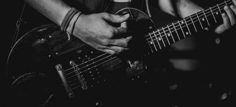 person-playing-on-a-guitar