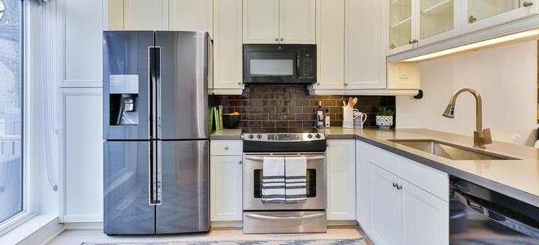 white kitchen with silver appliances