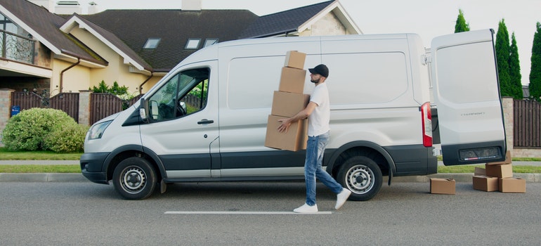 mover unloading the moving van when helping you move from florida to texas