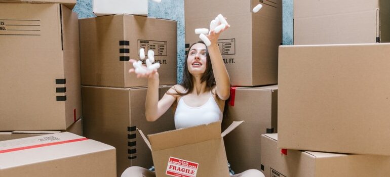 woman playing with packing peanuts