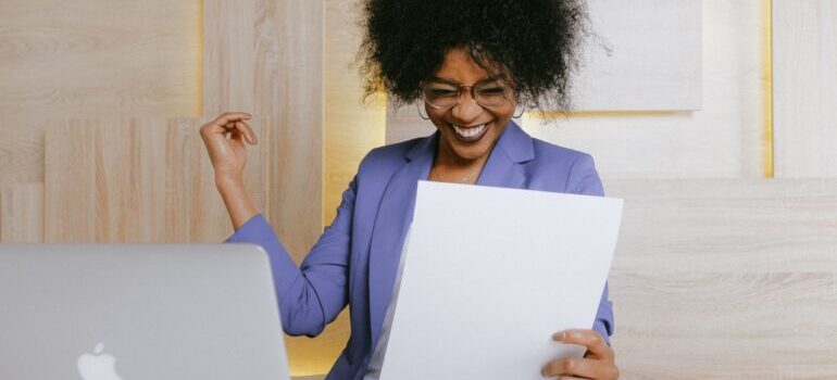 Woman holding a paper