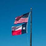 Texas and USA flags.