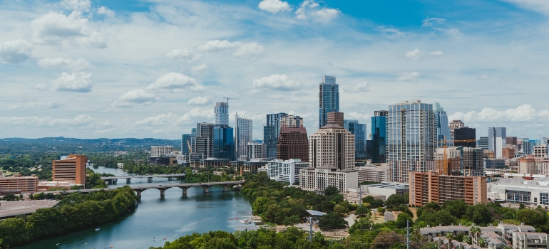 Austin downtown with river, bridge, and buildings is one of top locations for families in Texas. 
