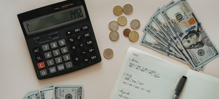 Money, a calculator and a notebook