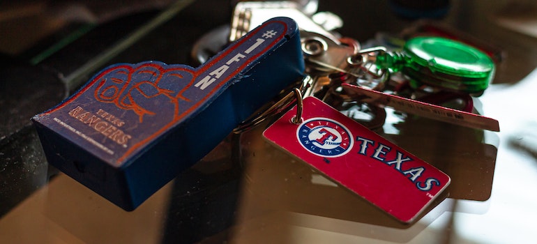 Keychains on a Glass Surface to bring along when moving to Texas. 