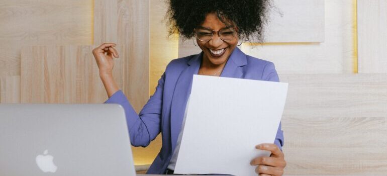 a woman happy about not having to do taxes 