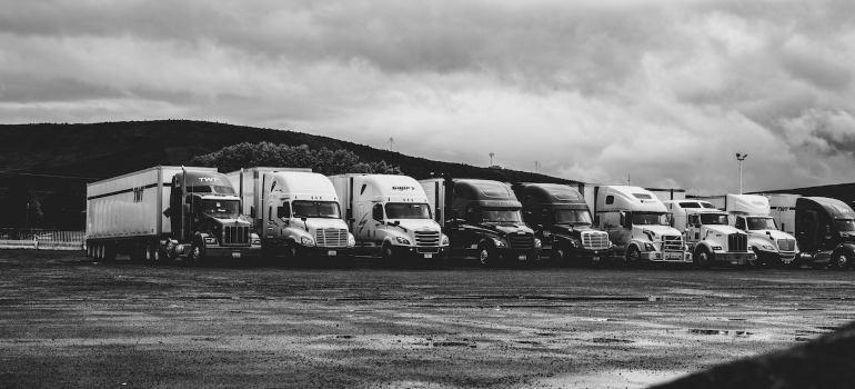 a black and white image of trucks that operate according to New DOT regulations 2022