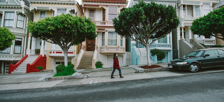 A woman walking in the street after moving from Salt Lake City to San Francisco