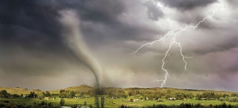 lightning and tornado hitting a village as one of the most popular reasons for moving