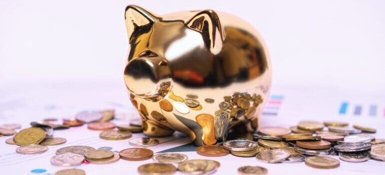 Piggy bank with coins around it