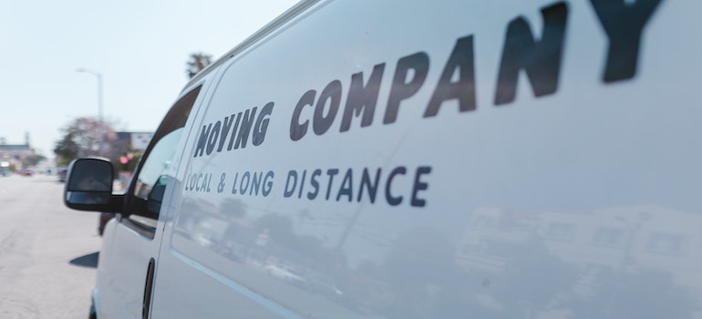 A white moving company 's van close up shot.