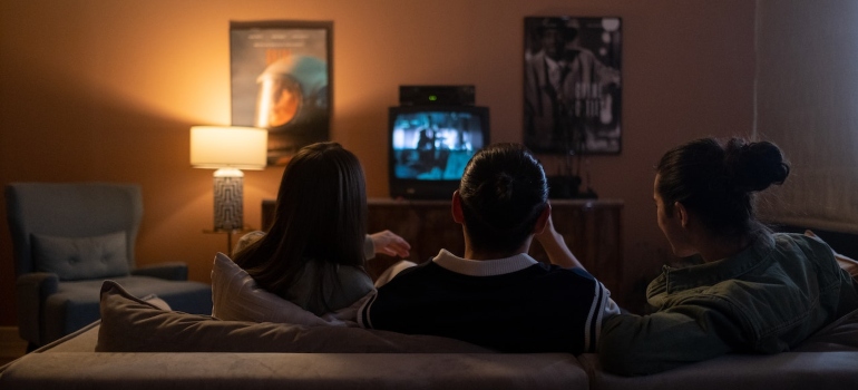 A family watching a movie, an ideal thing for the first night in your new home