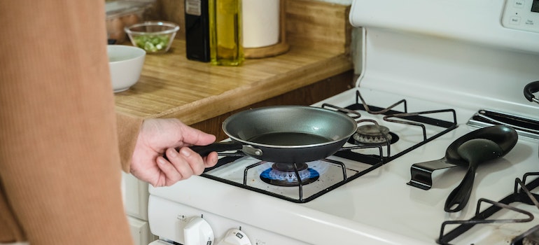 A person using a gas stove