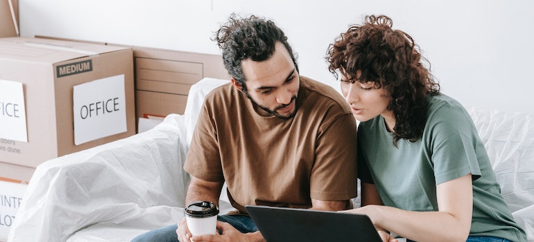 A couple looking at a laptop