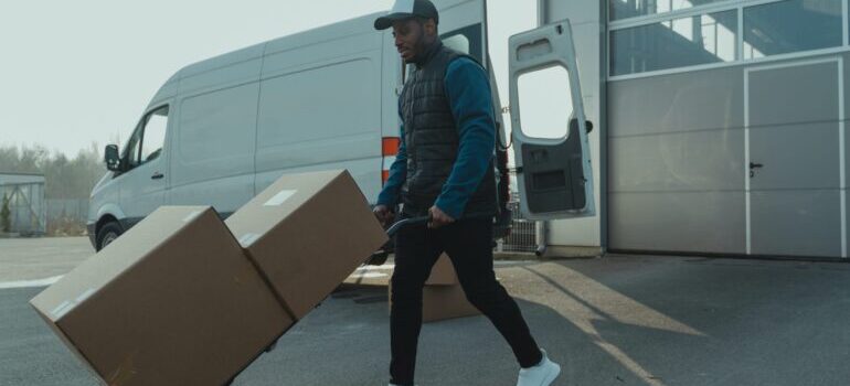 Man moving boxes from a truck