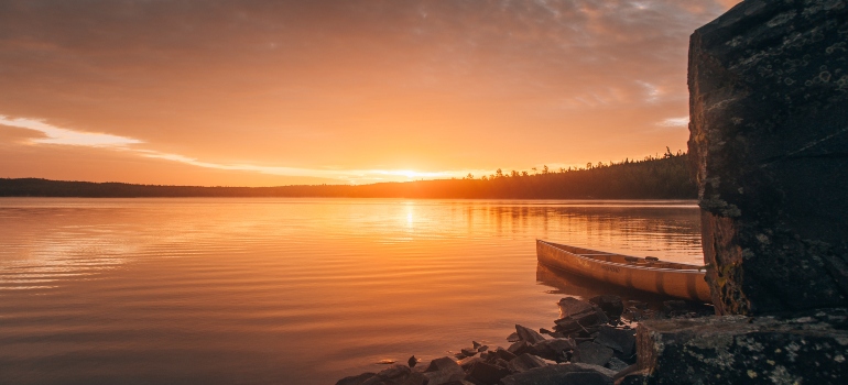 a lake at sunset with orange tones in Lakeville, Minnesota