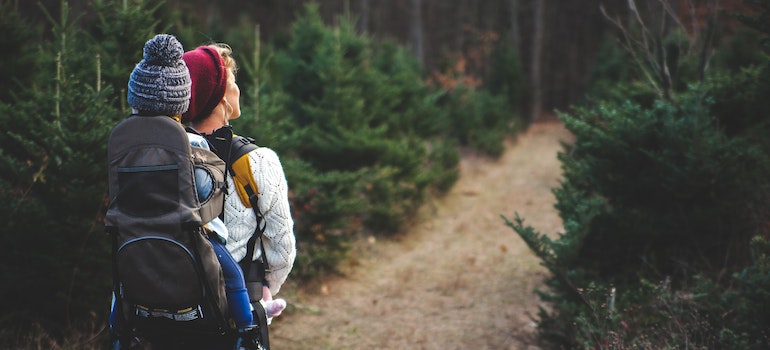 A woman and baby hiking