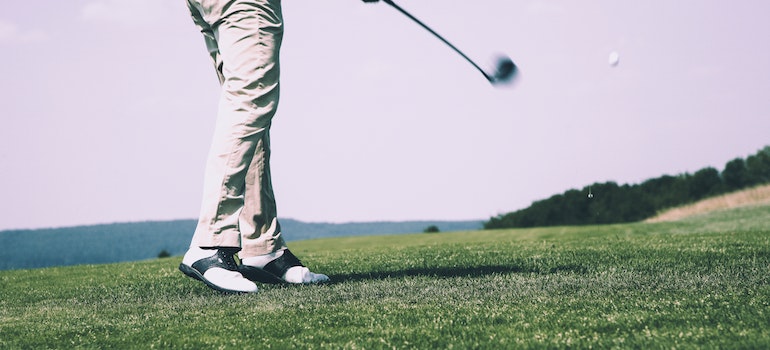 a man plays golf on the course