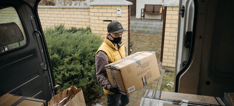 A mover holding a box