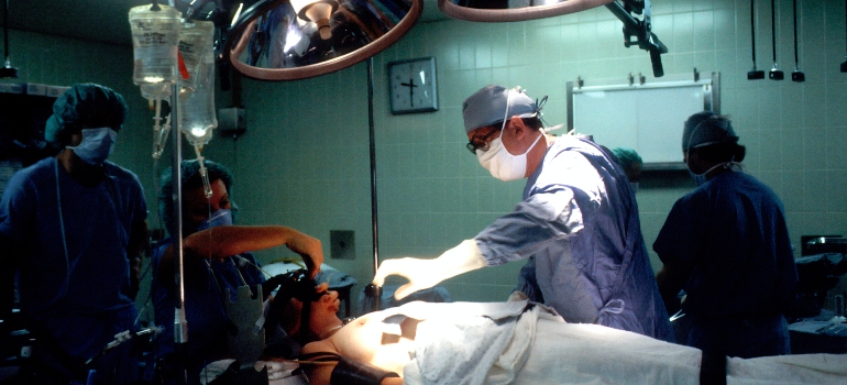 Doctor and nurses inside operating room