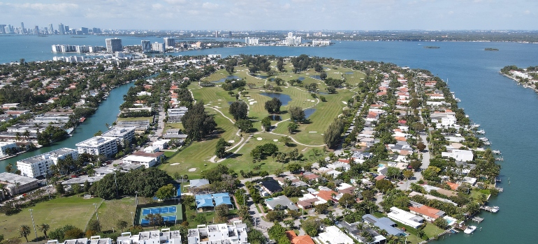 A lot of houses on the island surrounded by the water people live in after moving from San Antonio to Miami 