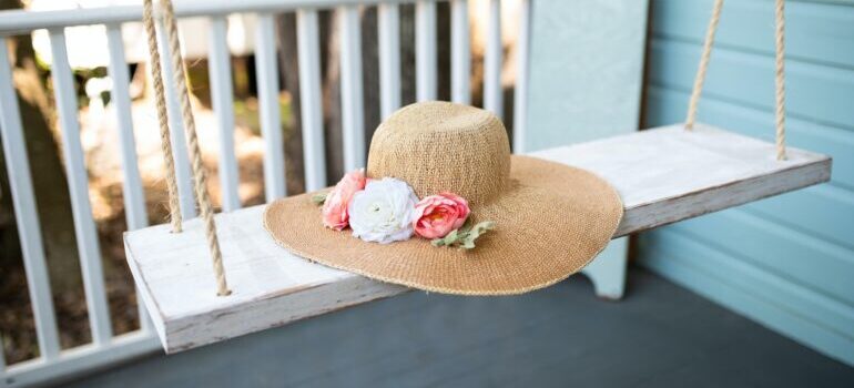 Female hat on a swing in a new house after being moved with best cross country movers Monroe