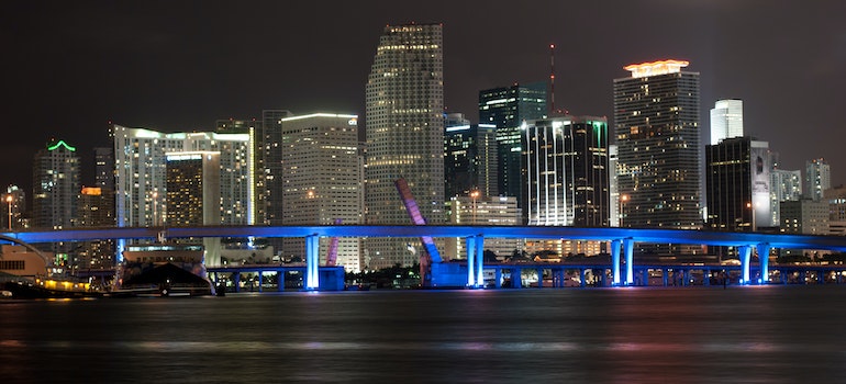Photo of a vibrant and lively Miami at night, which is something that also plays a part in moving trends in Miami