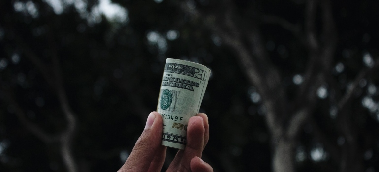 Picture of a person holding money 