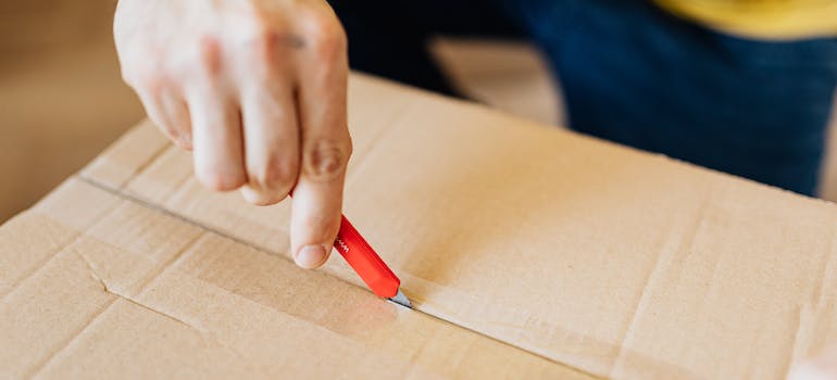 a person opening a box