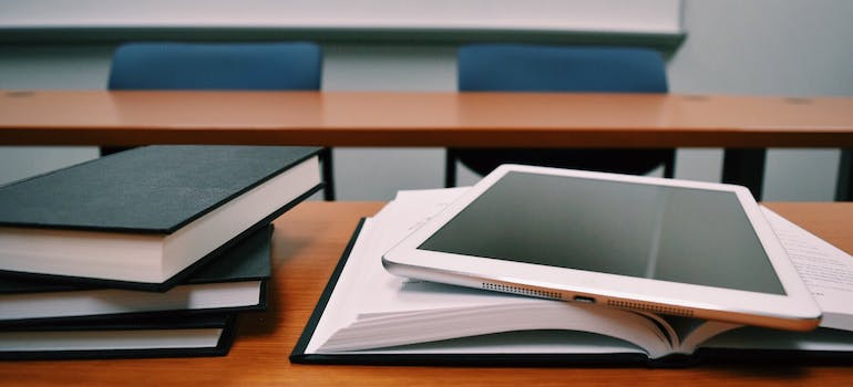 books and a tablet on a desk